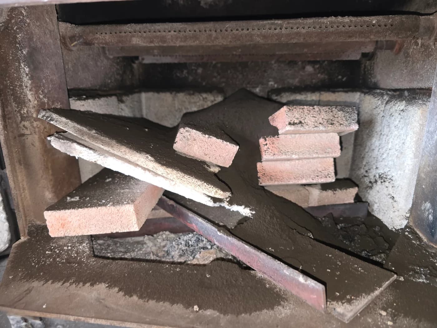 Soot visible in a wood stove with the baffle removed