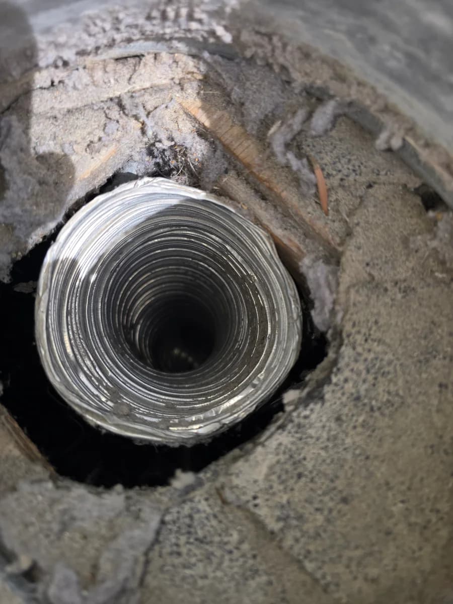Dryer vent opening after lint has been cleaned out