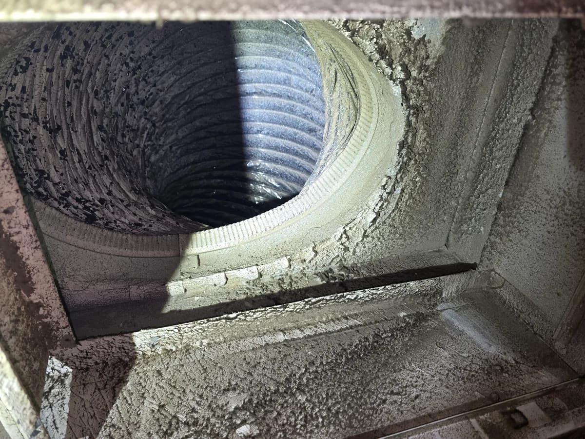 Visible dust and debris around an open air duct register