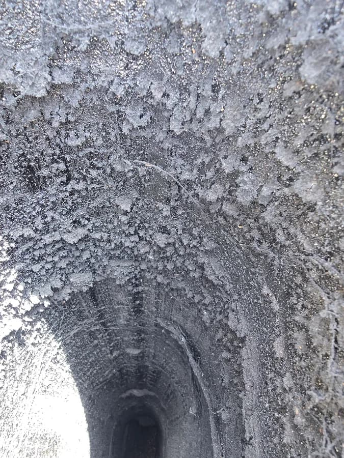 Heavy creosote buildup visible inside a chimney flue