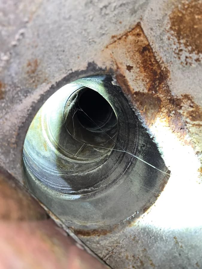 Rust visible near the opening of a prefabricated chimney flue