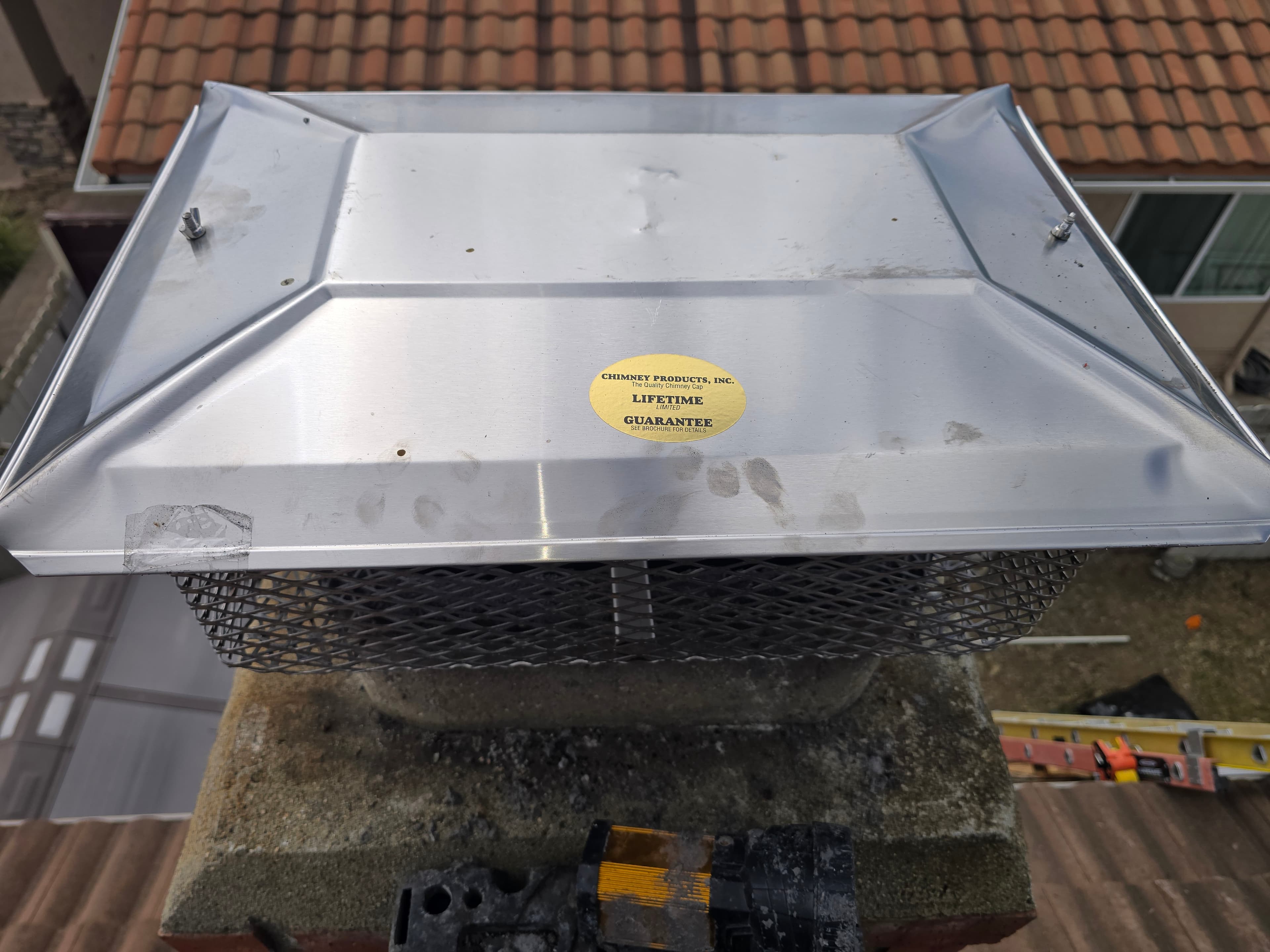 Stainless steel chimney cap showing top cover and side screening
