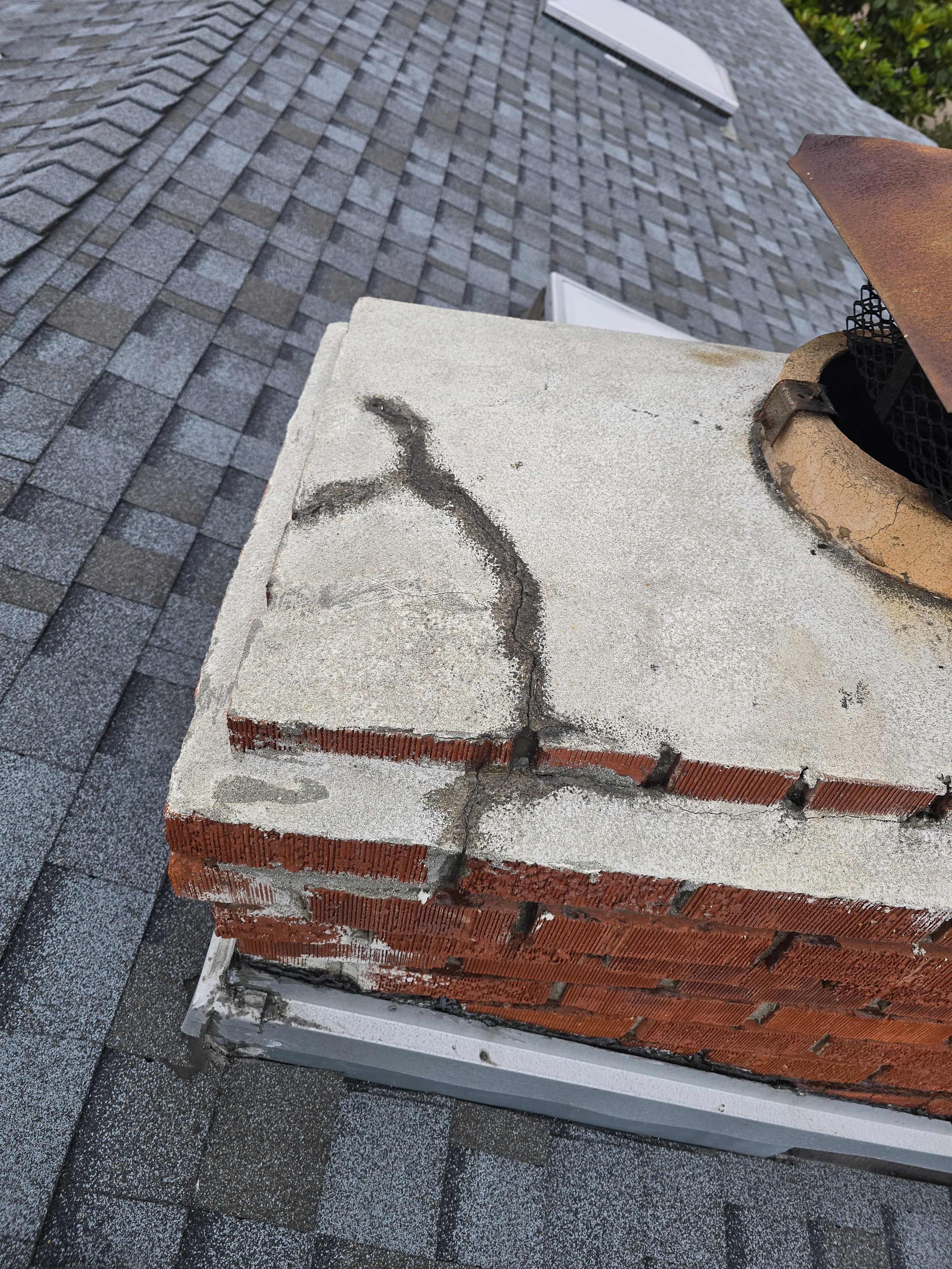 Wide cracking across a masonry chimney crown